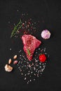 Top view of raw chuck eye steak with ingredients for cooking Royalty Free Stock Photo