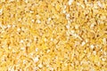 Top view of raw crushed polished wheat grains