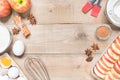 Top view raw ingredients for cooking apple pie on wooden background with copy space. Bakery background Royalty Free Stock Photo