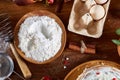 Top view raw ingredients for cooking strawberry pie or cake on wooden table, flat lay. Bakery background.