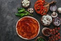 top view of raw pizza dough with sauce and vegetables Royalty Free Stock Photo