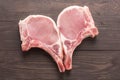 Top view raw pork chop steak on wooden background Royalty Free Stock Photo