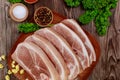 Top view raw pork shoulder sliced with skin on wooden table Royalty Free Stock Photo