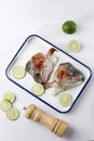 Top View Raw Salmon Head on Enamel Tray with Lime Royalty Free Stock Photo