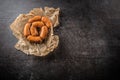 Top of view raw small cocktail sausages on cutting board