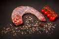 top view of raw turkey neck served with spices and tomatoes Royalty Free Stock Photo