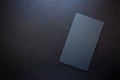 Top view on rectangle black slate plate on rustic dark background. Copy space Royalty Free Stock Photo