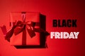 Top view of red christmas boxes with red ribbon on red background with copy space for text. black Friday and Boxing Day Royalty Free Stock Photo