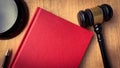 Top view of red cover book with gavel as background. Royalty Free Stock Photo