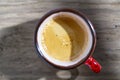 Top view a red cup of espresso coffee on wooden table background at morning, closeup Royalty Free Stock Photo