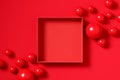 Top view of a red empty Christmas gift box with red spheres. Mockup for product presentation and advertisement Royalty Free Stock Photo