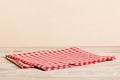 top view with red empty kitchen napkin  on table background. Folded cloth for mockup with copy space, Flat lay Royalty Free Stock Photo