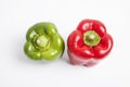 Top view of red and green fresh bell peppers over white background