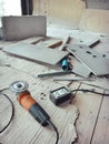 Top view grinder and tools concrete on corrugated paper and wooden floor in construction site with copy space Royalty Free Stock Photo