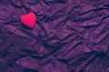 Top View Red Heart On Wrinkled Dark Purple Texture Background. Happy Valentine`s Day And Love Concept. Romantic Card, Banner Royalty Free Stock Photo