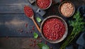 Top view of red legumes on a dark wooden kitchen table. Healthy food concept and detox or vegan menu. World Pulses Day. Copy Space
