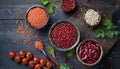 Top view of red legumes on a dark wooden kitchen table. Healthy food concept and detox or vegan menu. World Pulses Day. Copy Space