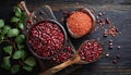 Top view of red legumes on a dark wooden kitchen table. Healthy food concept and detox or vegan menu. World Pulses Day. Copy Space