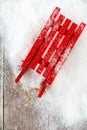 Top View of Red Sledge in Snow and on Wood Royalty Free Stock Photo