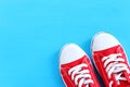 Top view of red sneakers over blue background Royalty Free Stock Photo