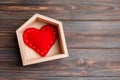 Top view of red textile heart in a house on wooden background. Home sweet home concept. Valentine`s day Royalty Free Stock Photo