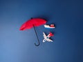 Top view red umbrella covered ship and airplane Royalty Free Stock Photo