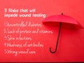 Top view red umbrella with text 5 risks that will impede wound healing on a red background