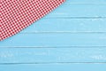 Top view red and white tablecloth on old blue wooden table background Royalty Free Stock Photo