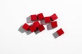 Top View of Red Wooden Game Cubes on White Background