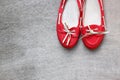 Top view of red worn woman shoes over wooden textured background. instagram style filter Royalty Free Stock Photo