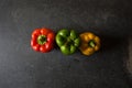 Top view of red, yellow and green bell peppers Royalty Free Stock Photo