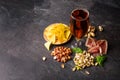 Top view of a refreshing alcoholic beverage with snacks. Beer and salty appetizers on a gray stone background. Copy Royalty Free Stock Photo