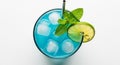 Top View of a Refreshing Blue Cocktail with Ice Cubes, Mint Garnish, and Lime Slice on White Background Royalty Free Stock Photo