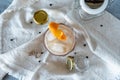 Top view of a refreshing drink served in a glass with ice and orange peel Royalty Free Stock Photo