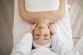 Top view of relaxed indian woman having neck massage in spa studio Royalty Free Stock Photo