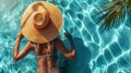 Top view of a relaxed woman floating in a swimming pool. The tropical atmosphere of a vacation helps a girl recuperate on vacation Royalty Free Stock Photo