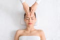 Top view of relaxed woman having facial massage Royalty Free Stock Photo