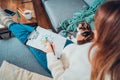 Top view relaxed young woman drawing work-life balance wheel sitting on the sofa with cat pet at home. Self-reflection Royalty Free Stock Photo