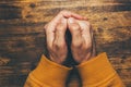 Top view of religious male crossed hands in prayer Royalty Free Stock Photo