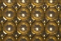 Top view of repetitive brown metallic plastic panel with multi domes