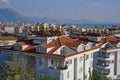 Top view of the residential areas of the city, the chain of hotels and the seaside resort town on a sunny day