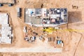 Top view of residential building under construction and yellow tower crane Royalty Free Stock Photo