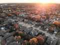 Top view residential subdivision with colorful leaves autumn sun