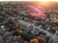 Top view residential subdivision with colorful leaves autumn sun