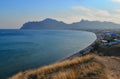 top view of resort town on coast of Black Sea bay among mountains and rocks, blue water Royalty Free Stock Photo