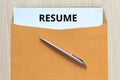 Top view of resume document in envelope on desk