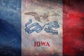 Top view of retro flag of Iowa with grunge texture. Flag background