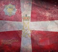 Top view of retro flag Royal Life Guards, Denmark with grunge texture. Danish patriot and travel concept. no flagpole. Plane