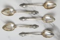 Top view of retro stylish spoons on the white table.Kit of vantage spoons Royalty Free Stock Photo