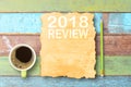 Top view with 2018 REVIEW on old paper and coffee cup,pencil on Royalty Free Stock Photo